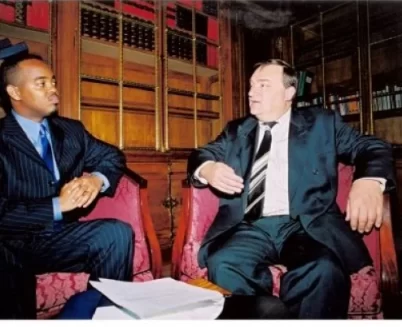 Gerald La Touche engages with UK Government Minister at the Houses of Parliament in London.